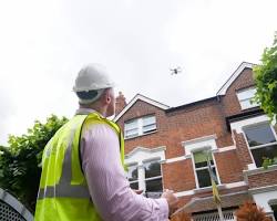 Drone inspecting a building facade